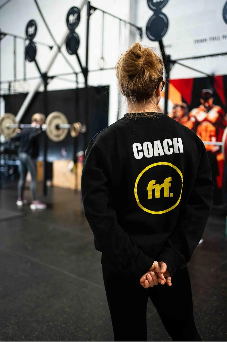 FRF coach wearing a Coach hoodie