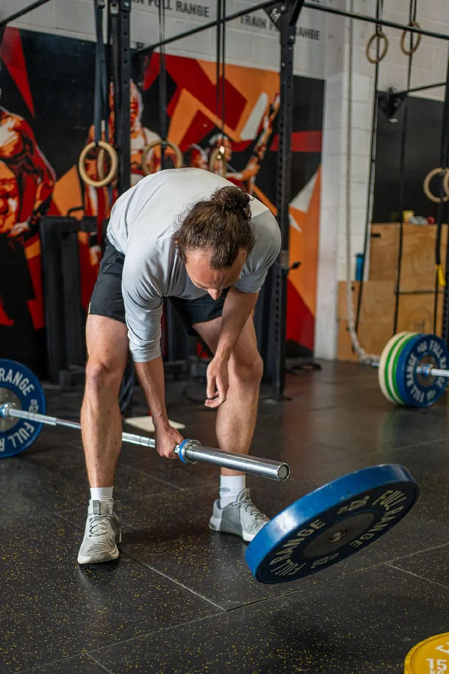 Member setting up a barbell lift
